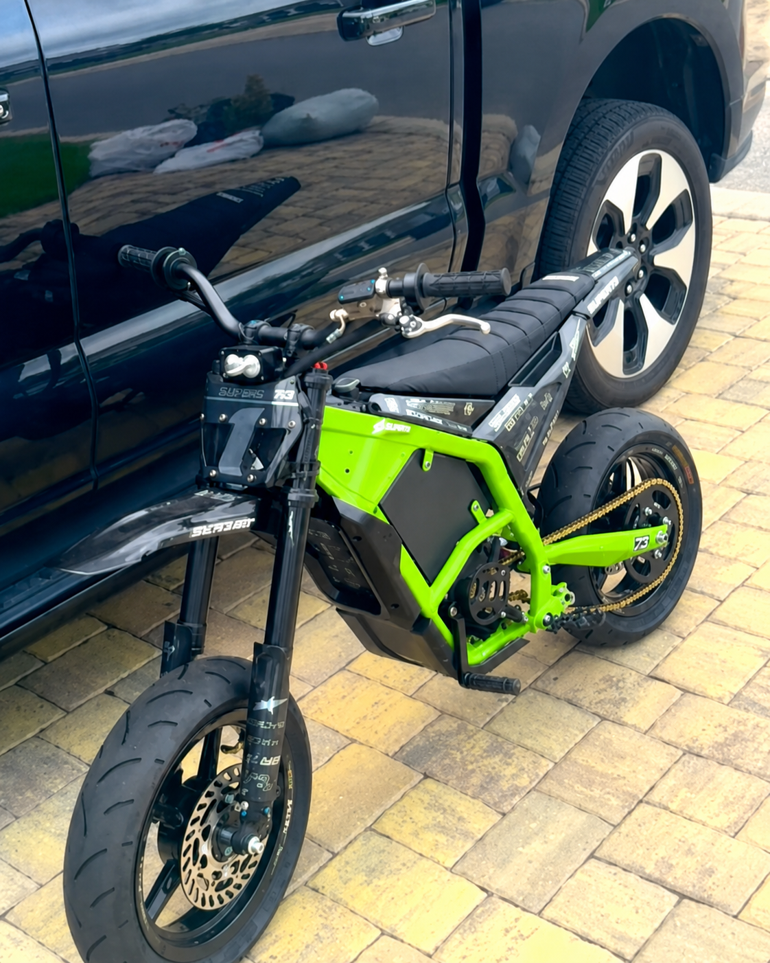 Custom green Sur-Ron supermoto build